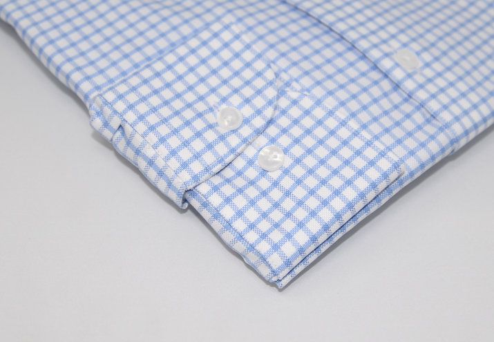 Light blue shepherd check dress shirt sleeve