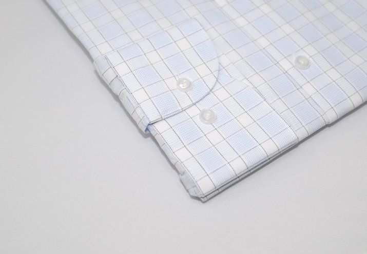 Light blue and white gingham check dress shirt sleeve